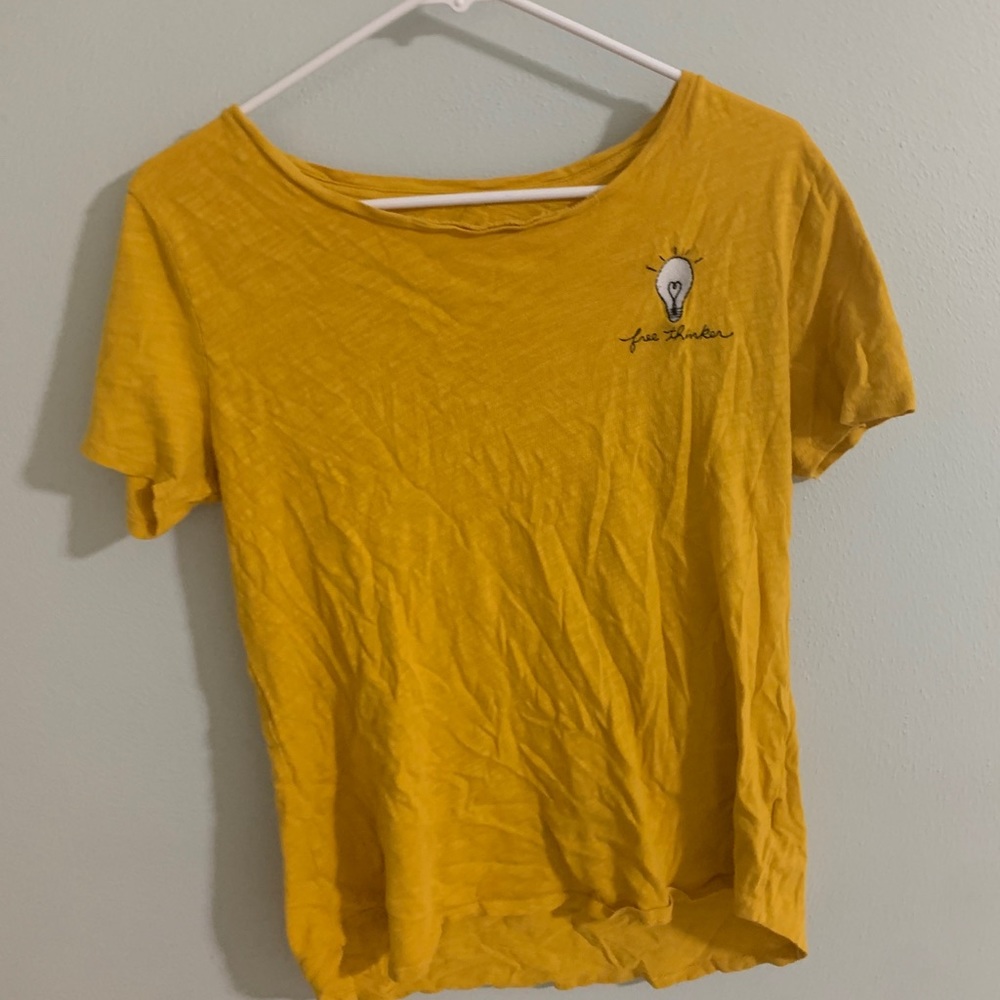 Yellow free thinker shirt.